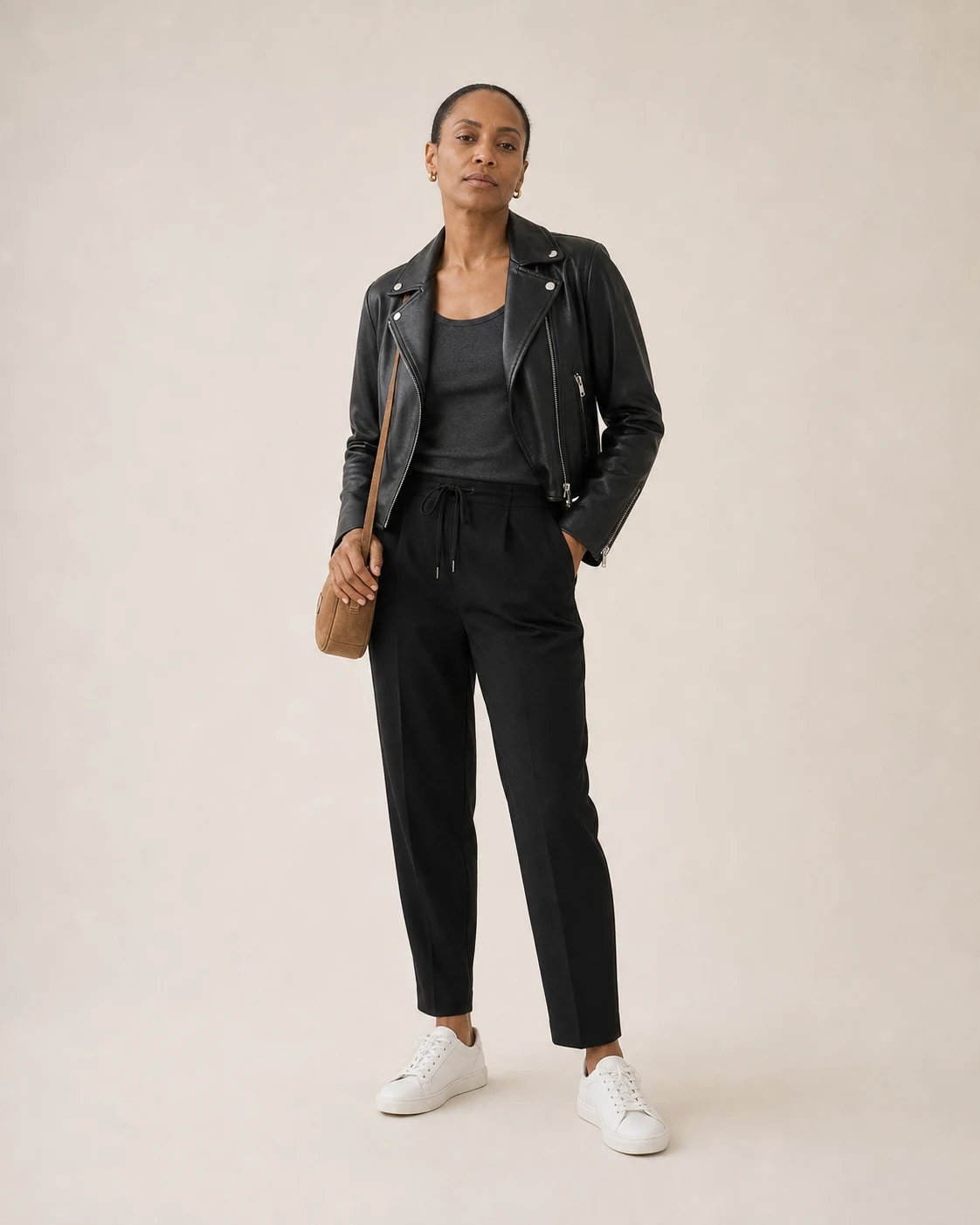 Composition 07 worn with charcoal tank, black drawstring trousers, white sneakers, black biker jacket, and tan crossbody